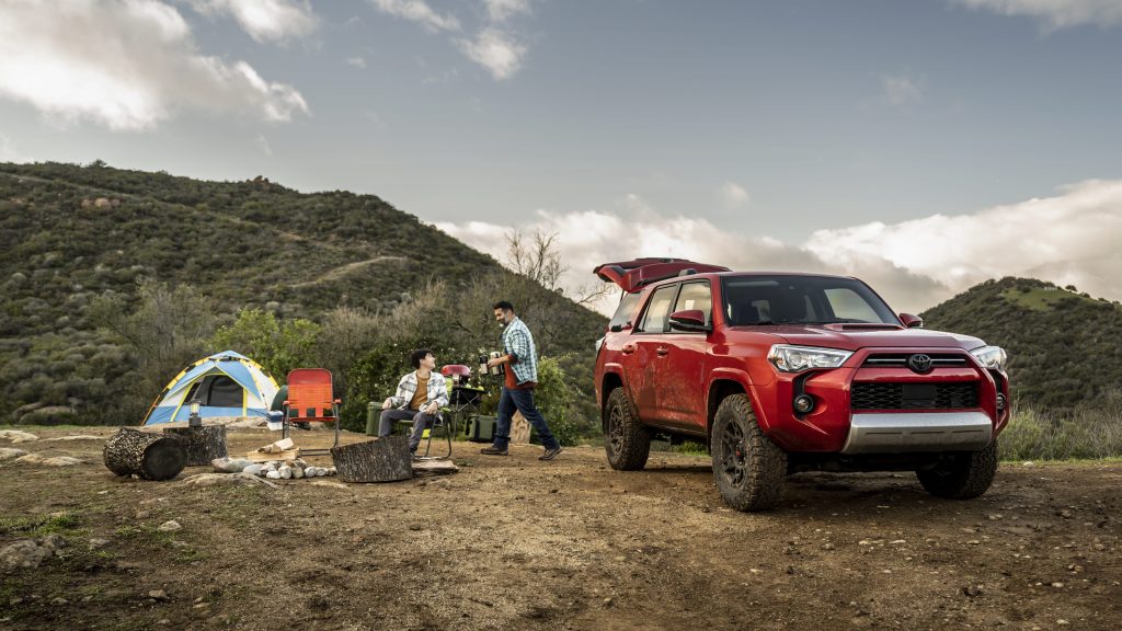 Family on camping trip in their Toyota SUV